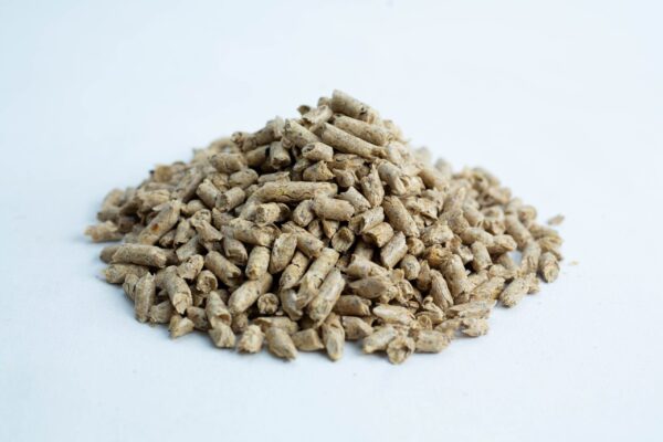 A pile of beige cylindrical Lupin Hull Pellets 100% Non-GMO, Australian grown, is shown on a white background.