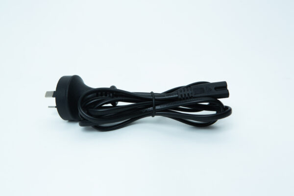 Black power lead with a two-pin plug, coiled neatly and secured with a twist tie, on a white background.