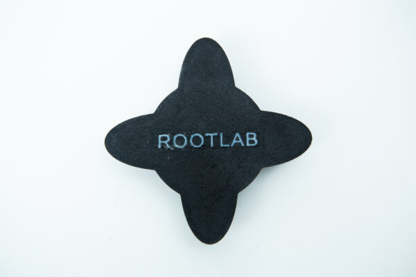 Black, four-pointed petal-shaped object with ROOTLAB text in white at its centre, on a white background.